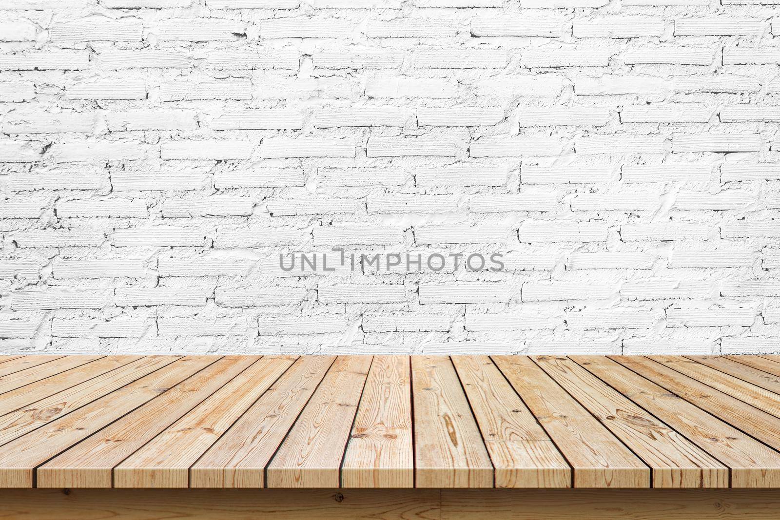 empty wooden table top on white brick wall background, used for display or montage your products by kaisorn