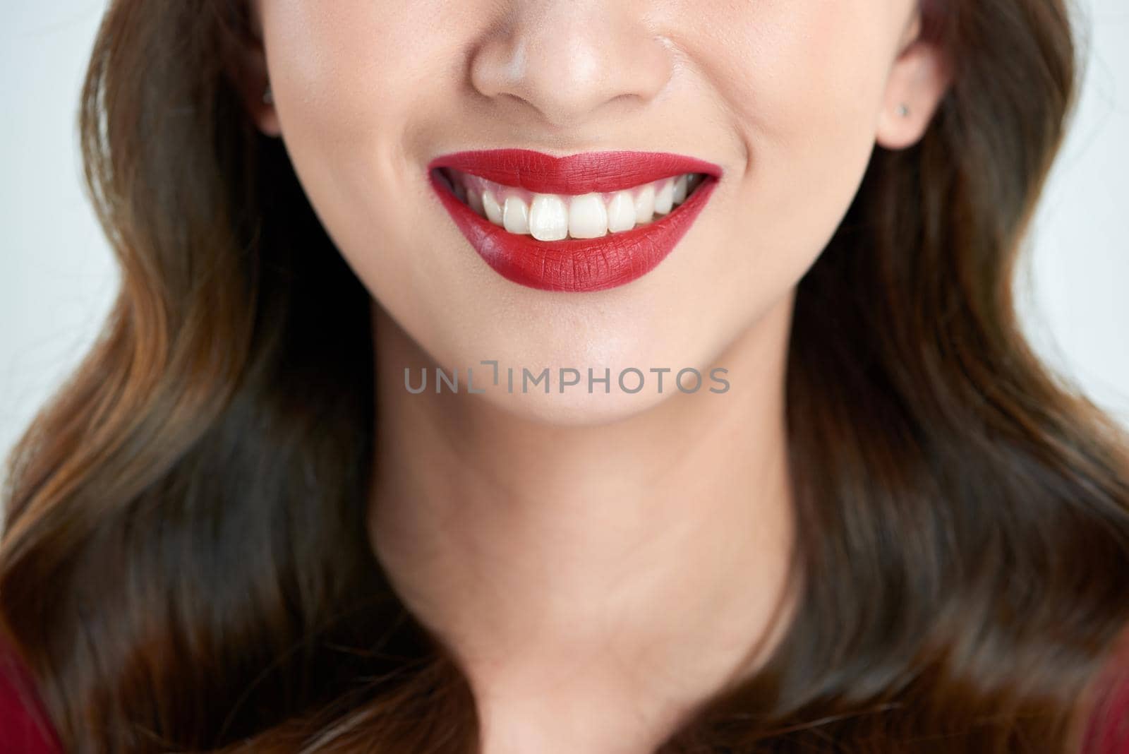 Female lips closeup. Beautiful smile of young fresh woman.