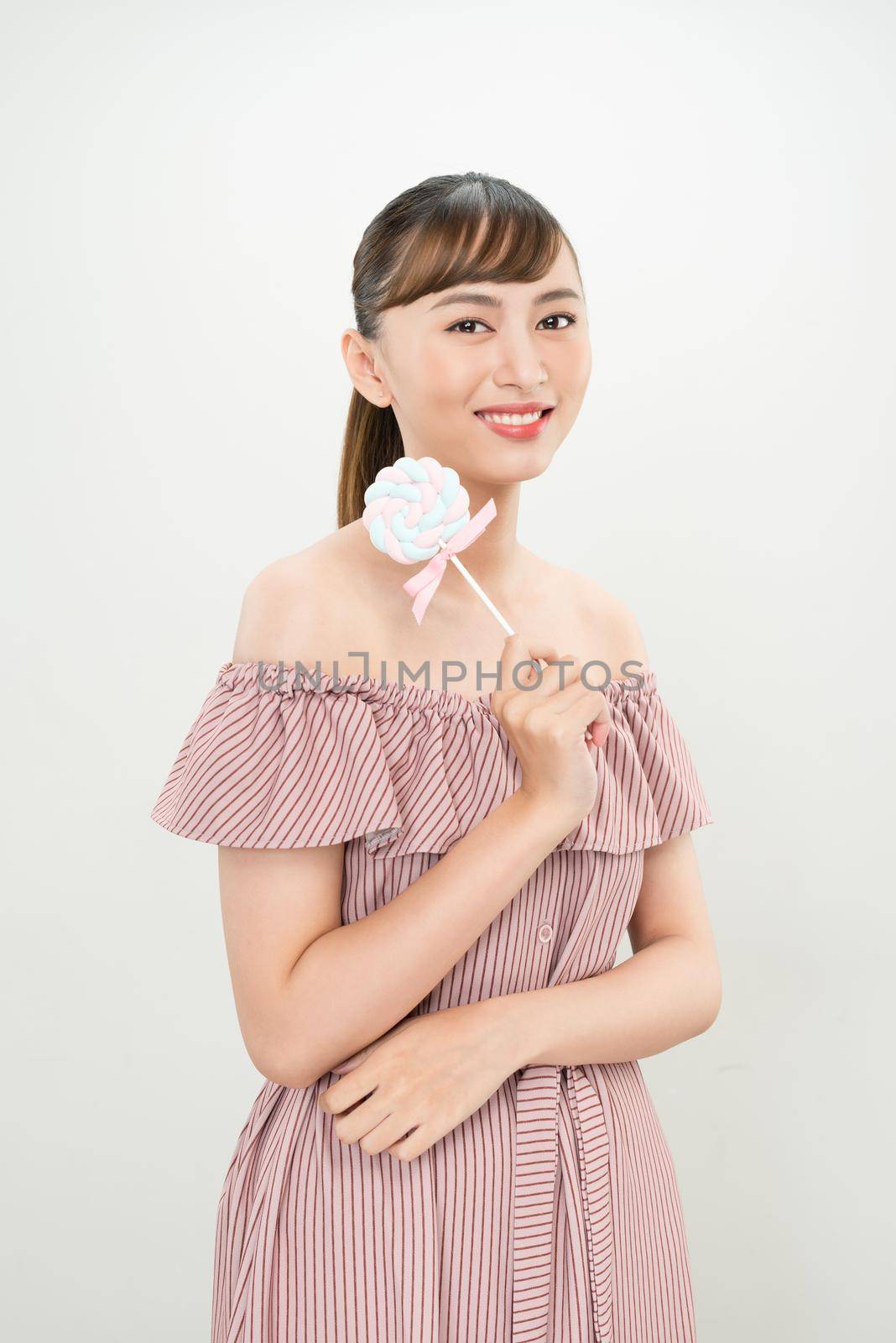 young asian woman with lolipop 