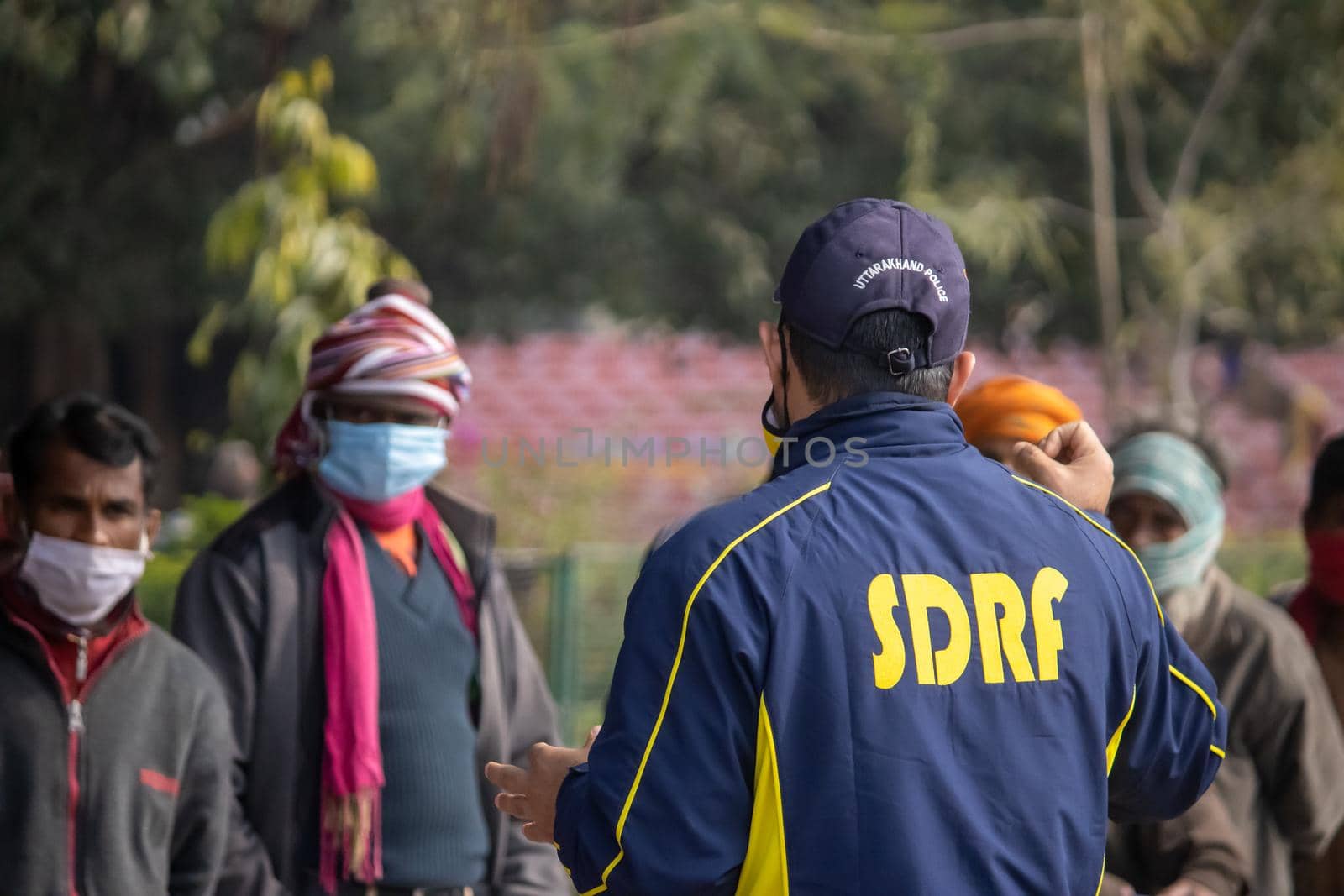 Policemen spreading awareness of protection from Coronavirus to stay safe from Coronavirus during Maha Kumbh 2021 by stocksvids