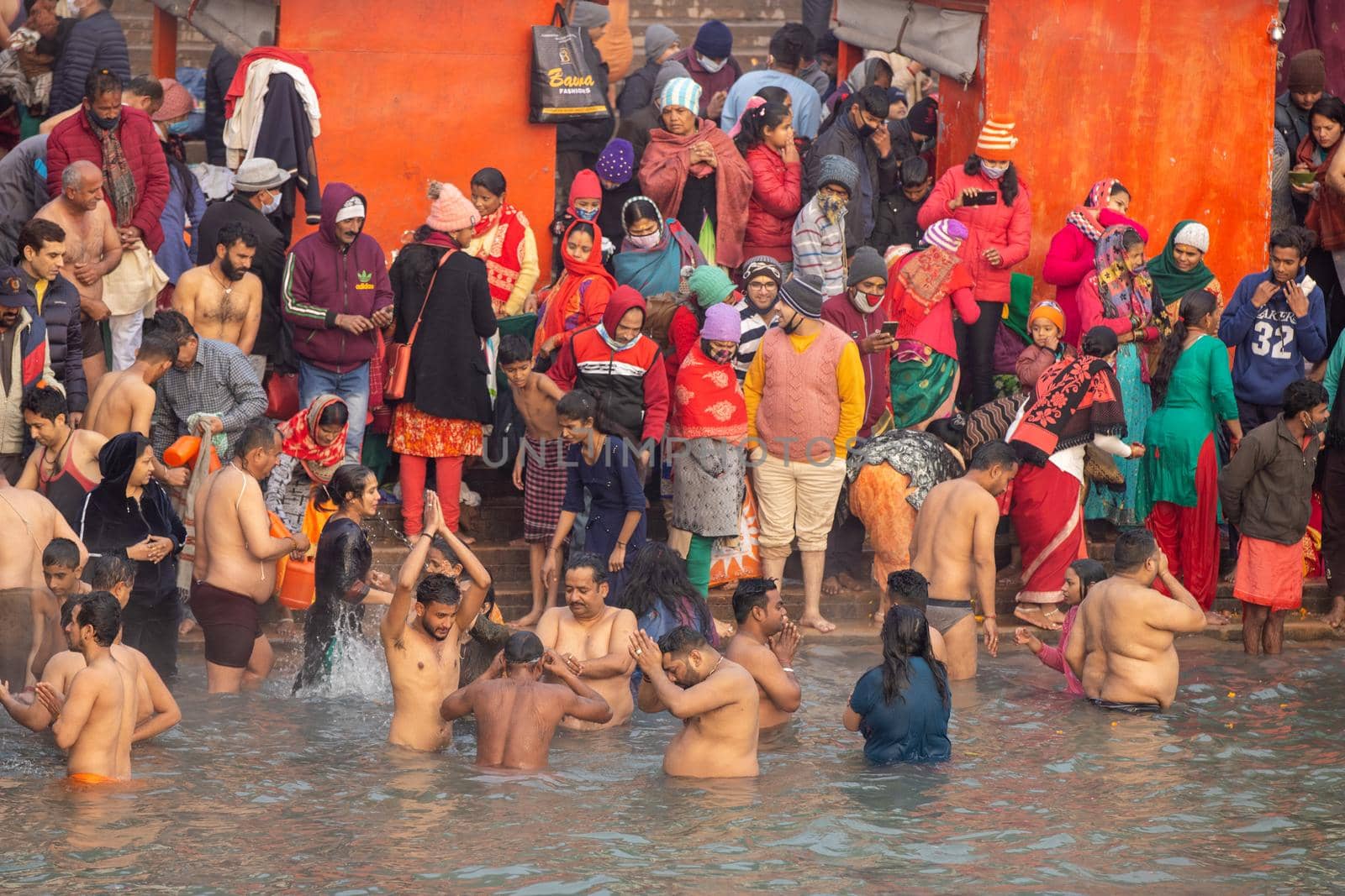 Haridwar, Uttarakhand, India, April 14, 2021. Pilgrims Holy dip in river Ganges, The Home of Pilgrims in India, Kumbh Nagri Haridwar Uttarakhand India.Religious Nagri Haridwar, The Highly visited pilgrimage place in India. City of Holy River Ganga. High quality photo