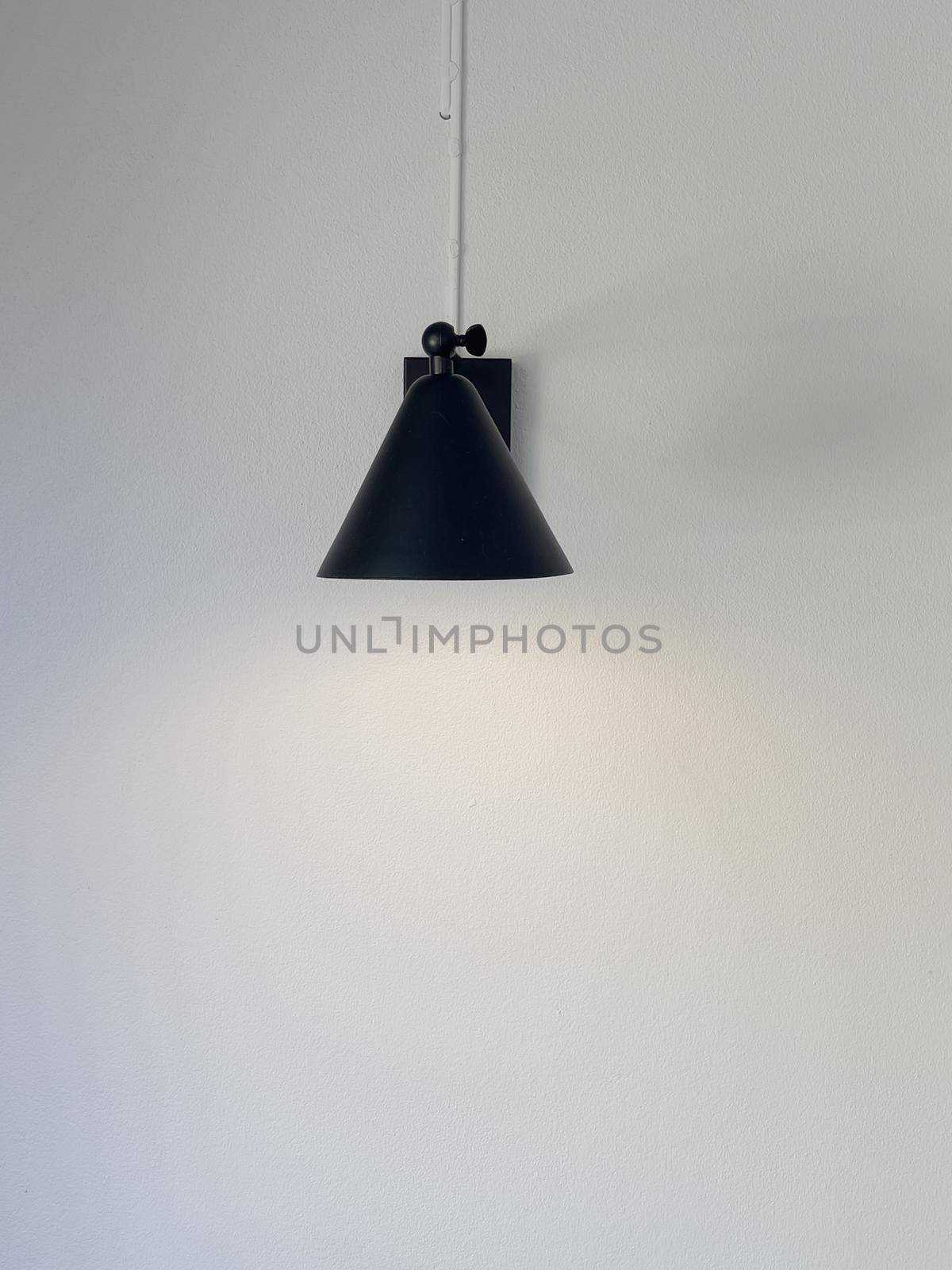 Black lamp hanging from the ceiling, stock photo