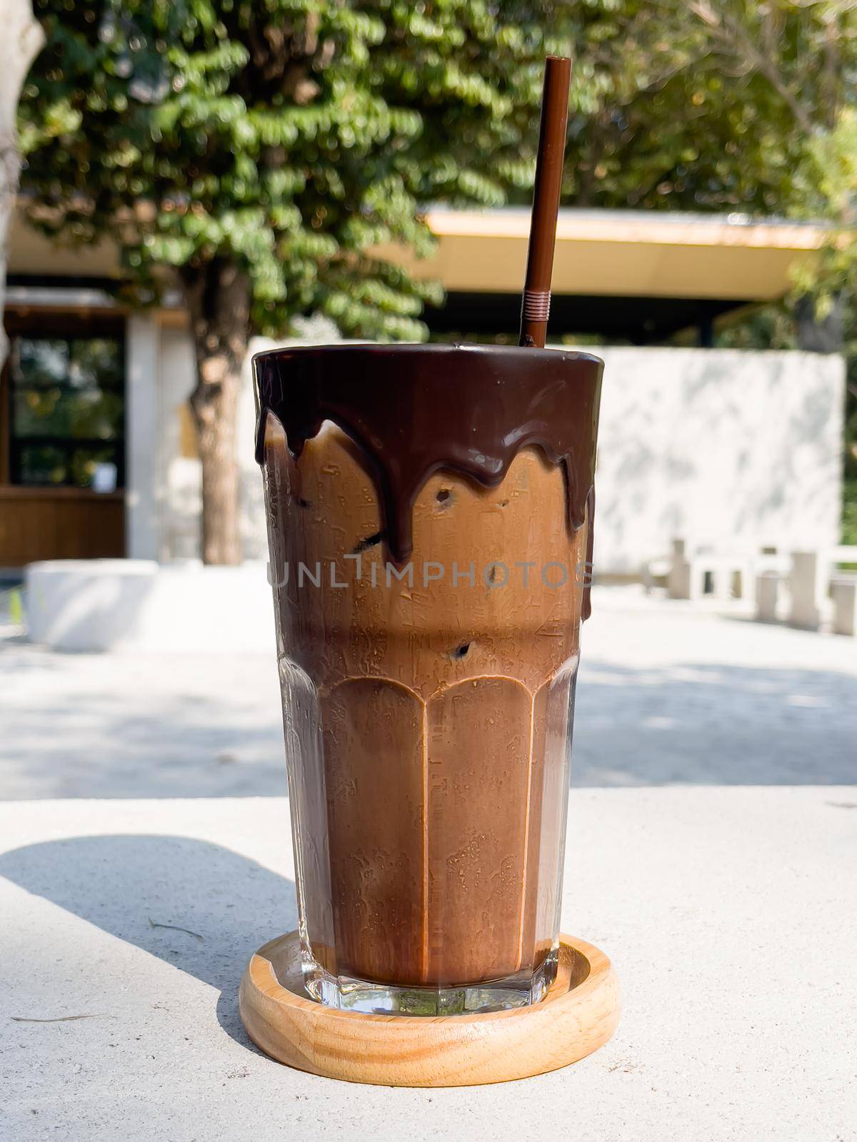 Iced mocha on concrete table by punsayaporn