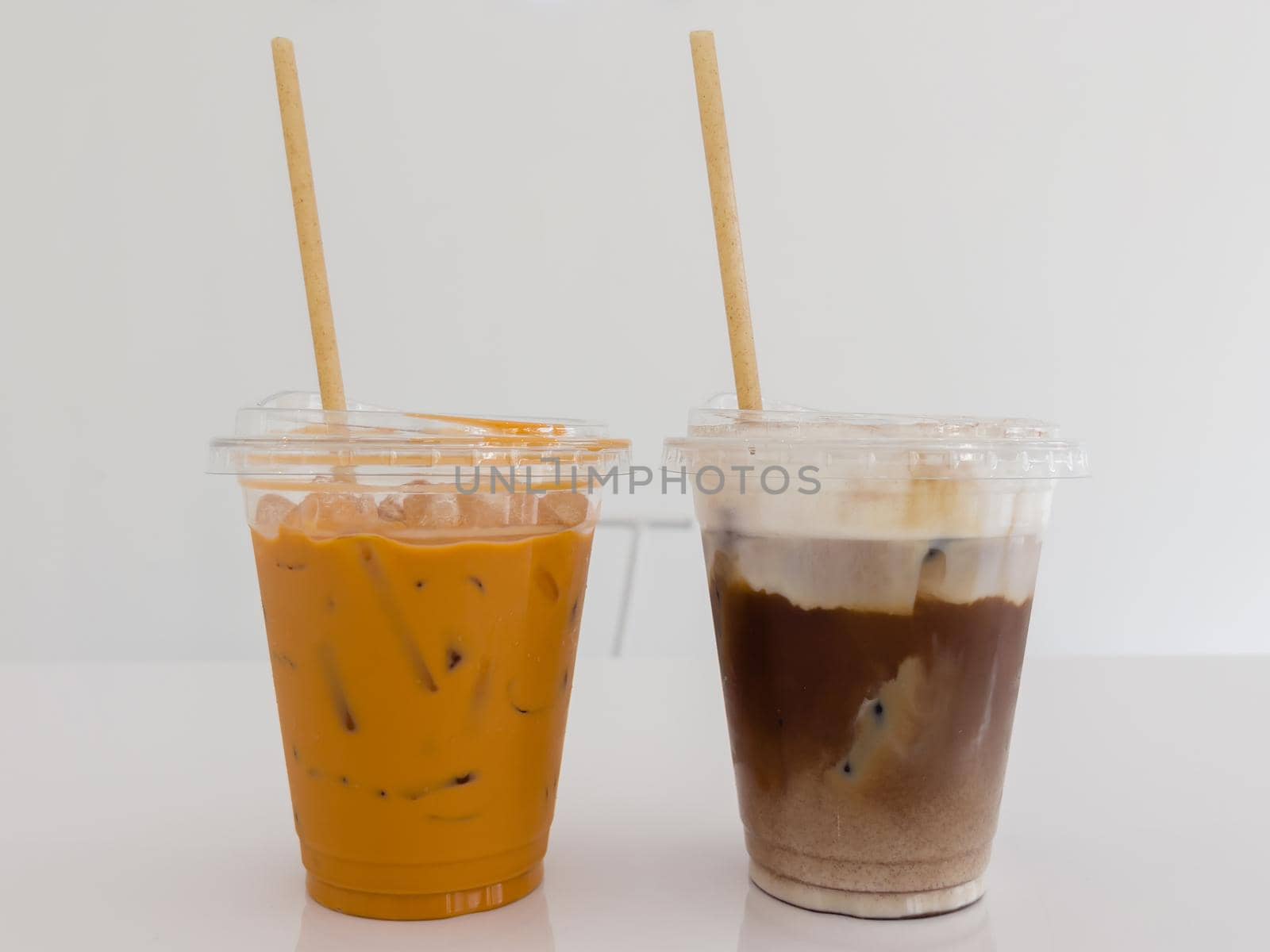 A glass of iced mocha and iced thai milk tea, stock photo