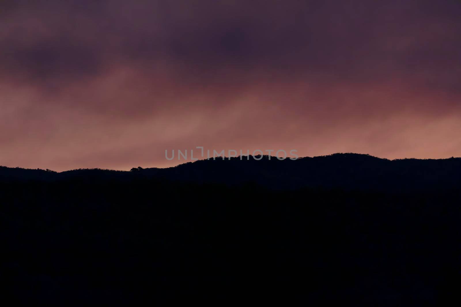 Photograph of bushfire smoke at sunset from hazard reduction burning in the Blue Mountains in New South Wales in Australia