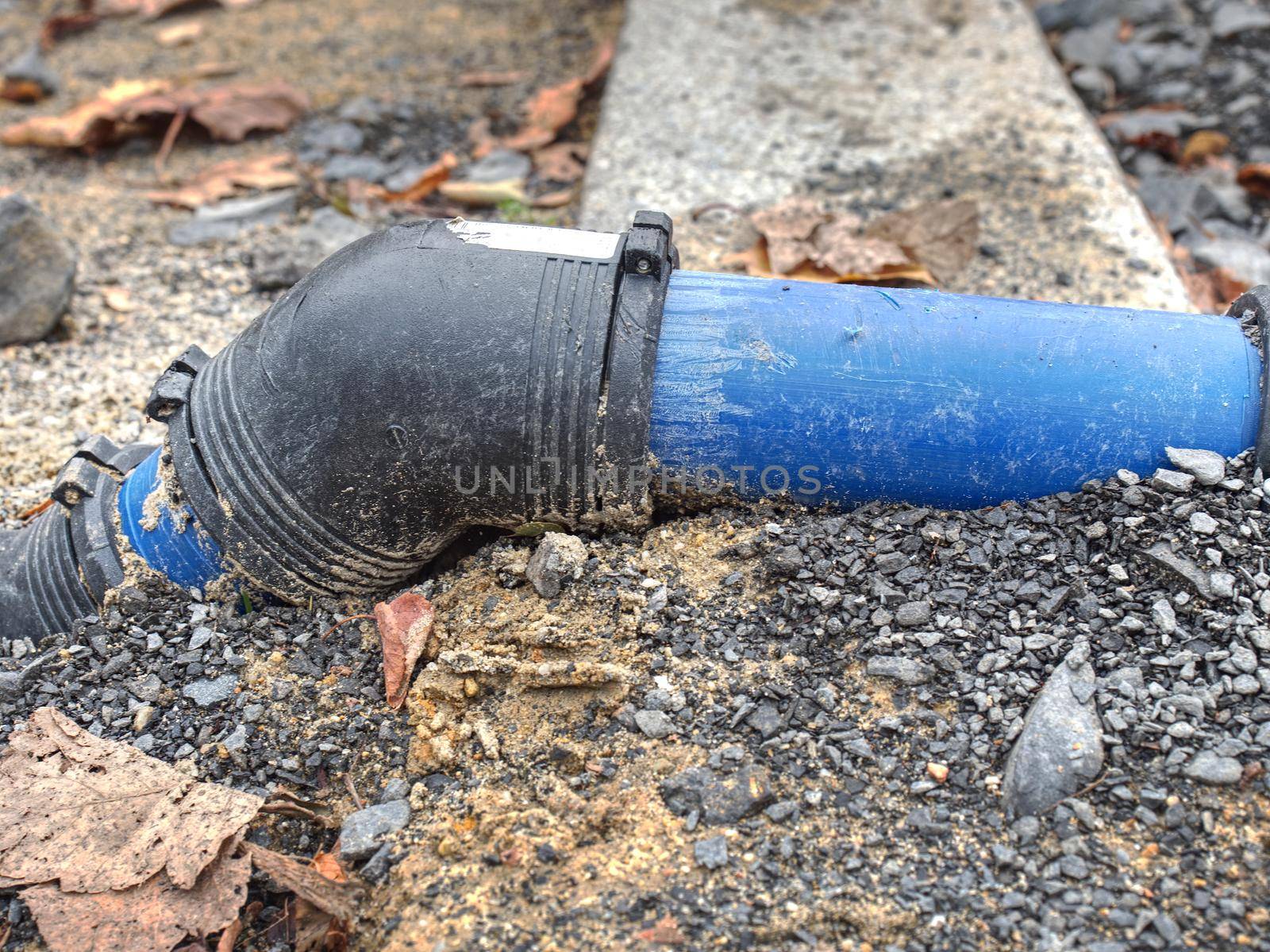 Blue steel water branch pipe installation in excavated trench by rdonar2