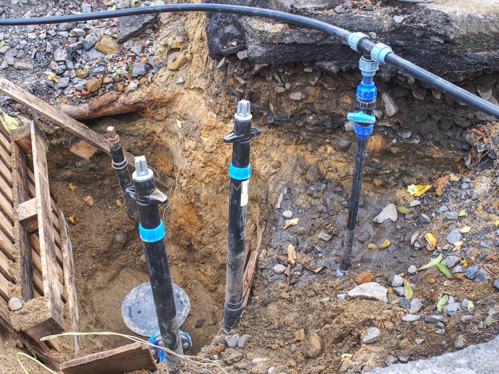 Reneval potable water system in the city. Laying plastic water pipes at the corner of a flat house