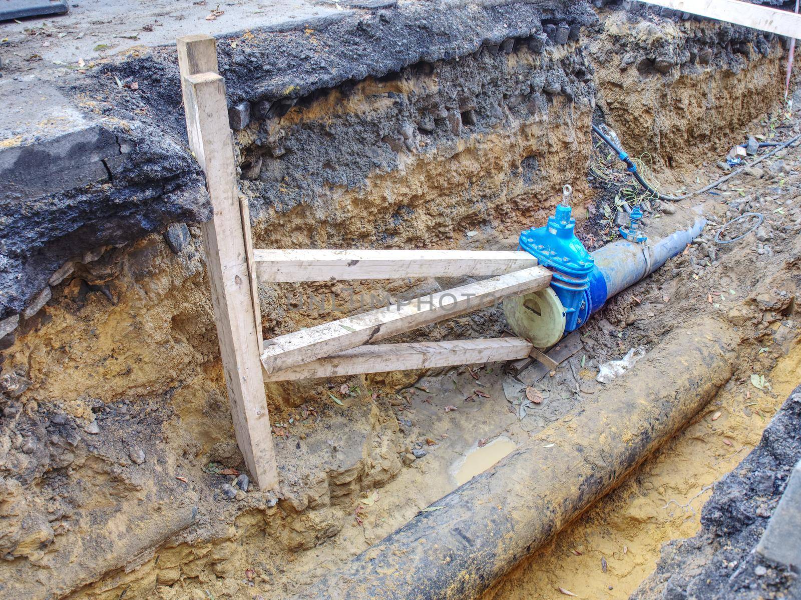 Building site in front of flat house. Repairing of water supply pipeline. Drink water supply system