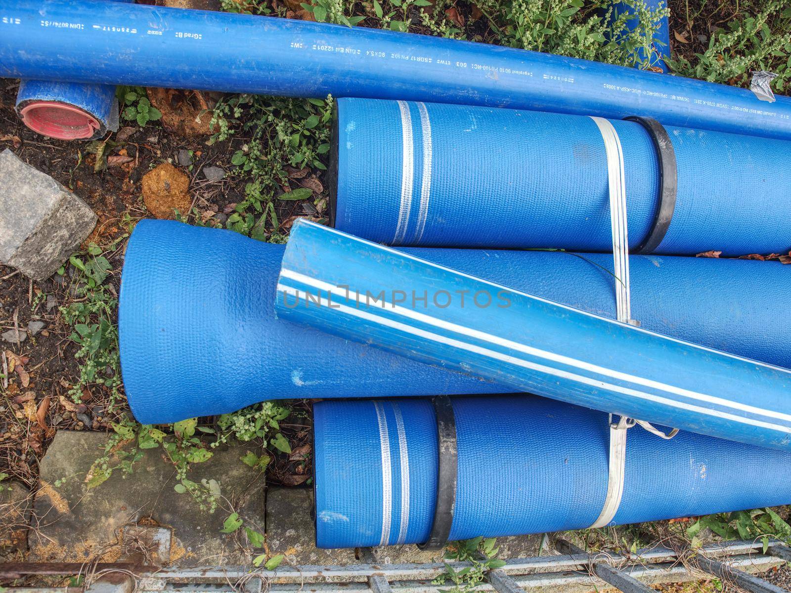 Blue Plastic Pipes For New Water System ready in stock at construction side. HDPE tubes