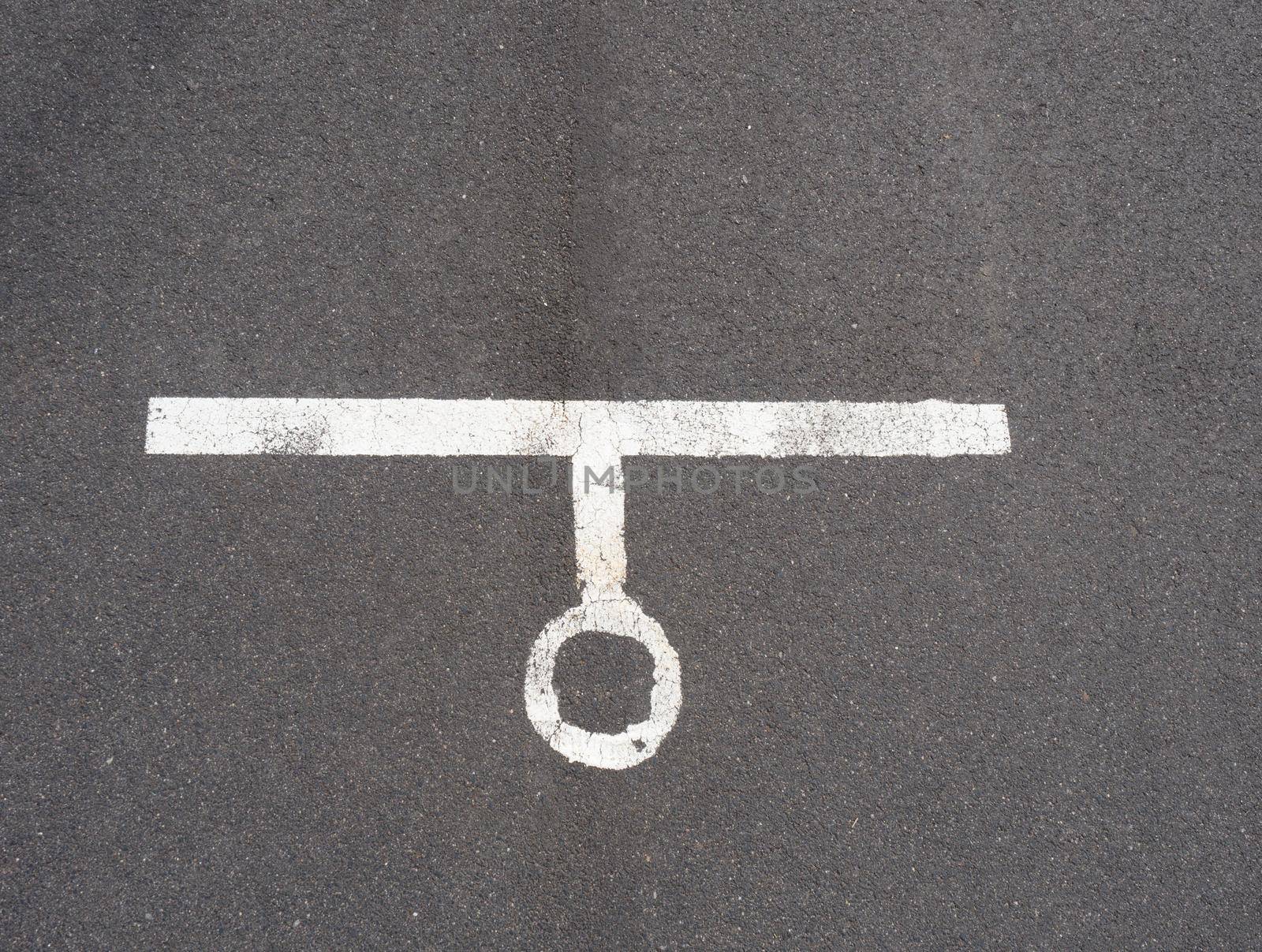 White paint line on old obsolete asphalt plaground. Empty kids areal.