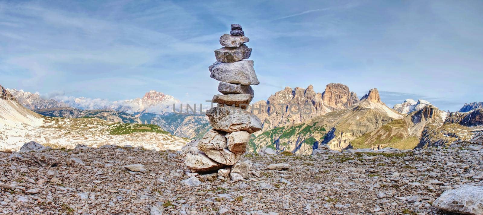 Pebbles pyramid. Stones on Alpine gravel  at Tre Cime di Lavaredo, view from tour around at April midday, Dolomite Alps Italy