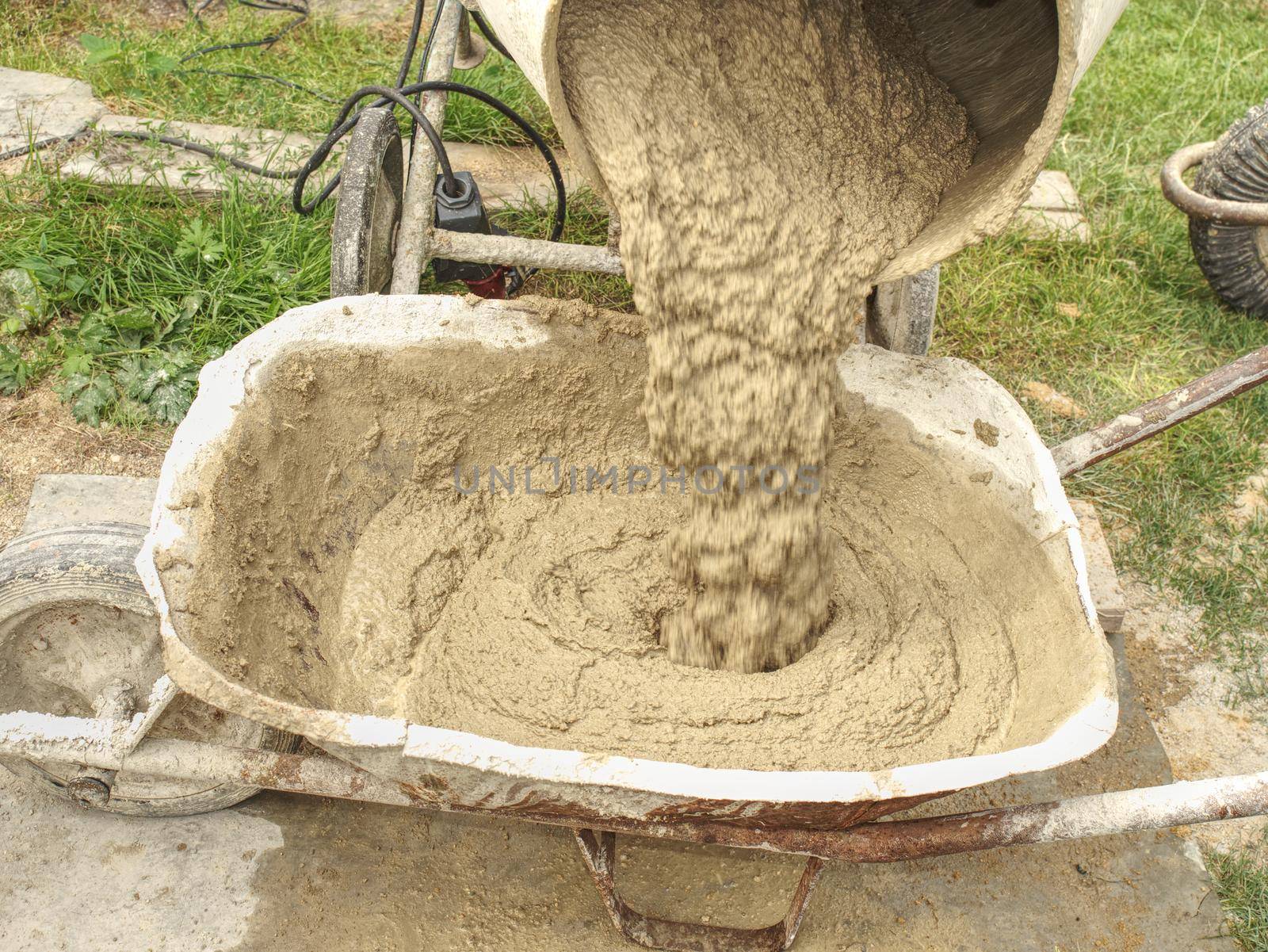 Concrete mixer detail. Making concrete in the mixer at the construction site