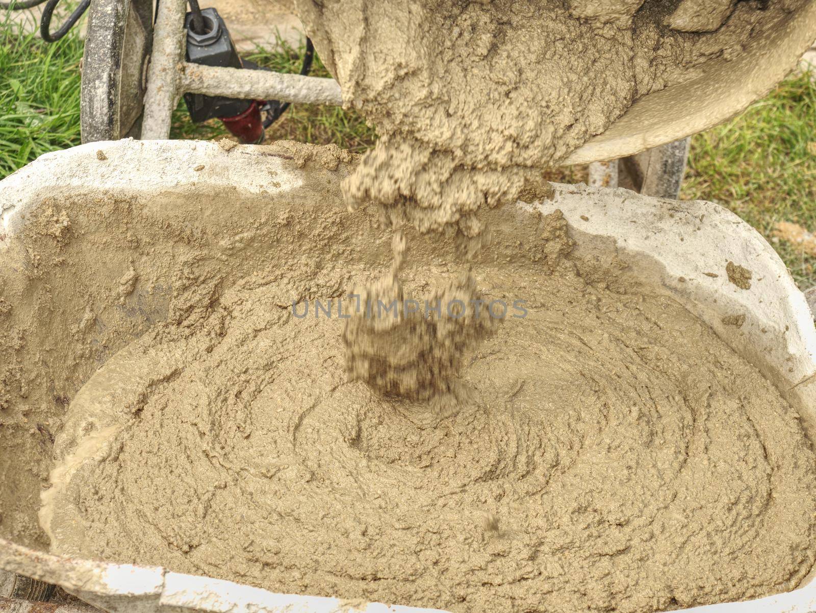 Concrete mixer detail. Making concrete in the mixer at the construction site
