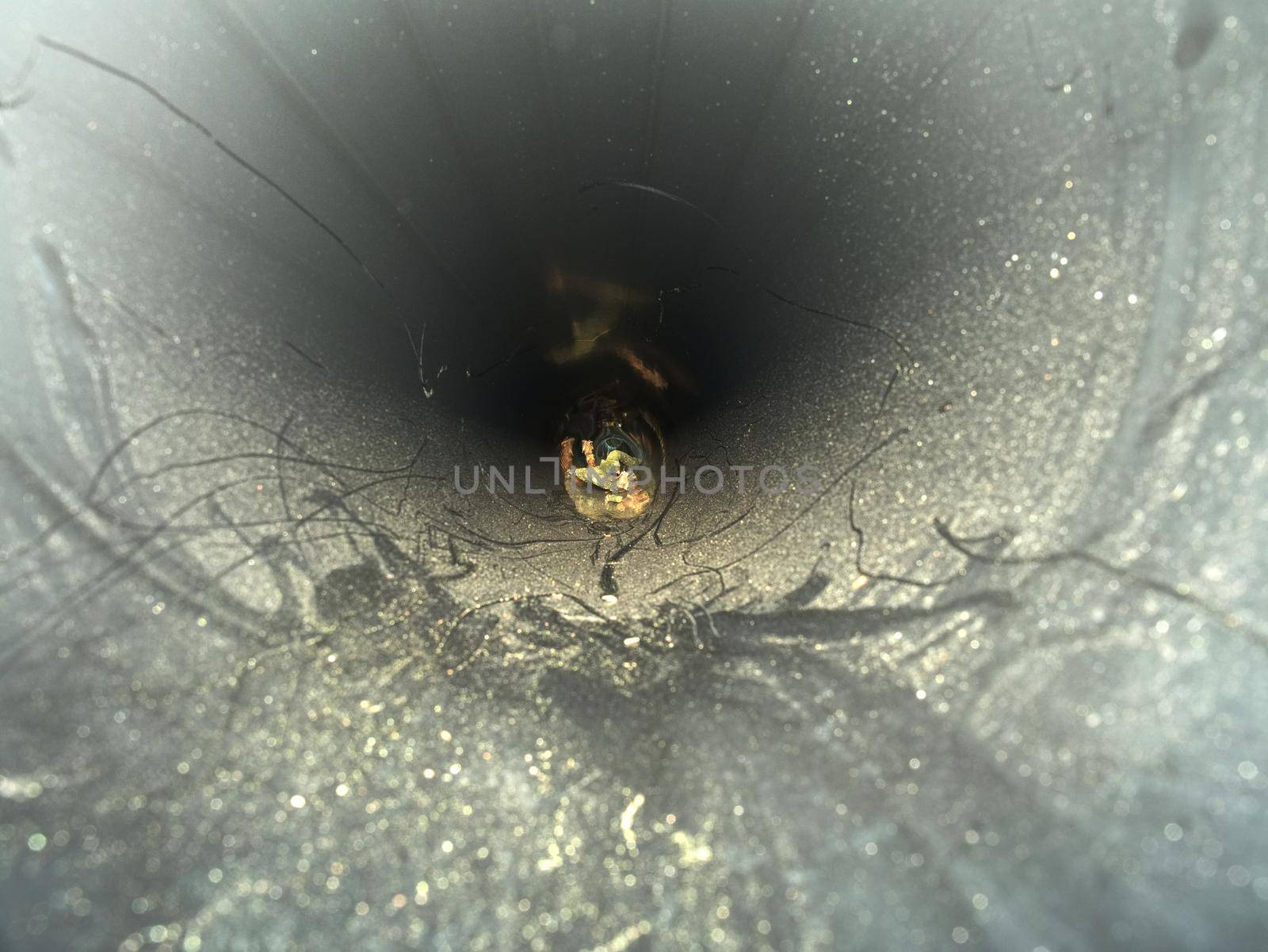 Inside of HDPE pipe. Laying of high press plastic water pipes at building side. Process of using plastic tubes