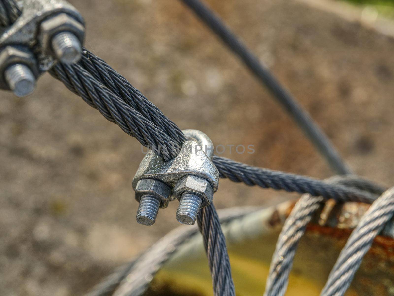 Shackles attached to wire cables and safety net.  Stainless steel screw bolt and wires for maintaining tightened safety net
