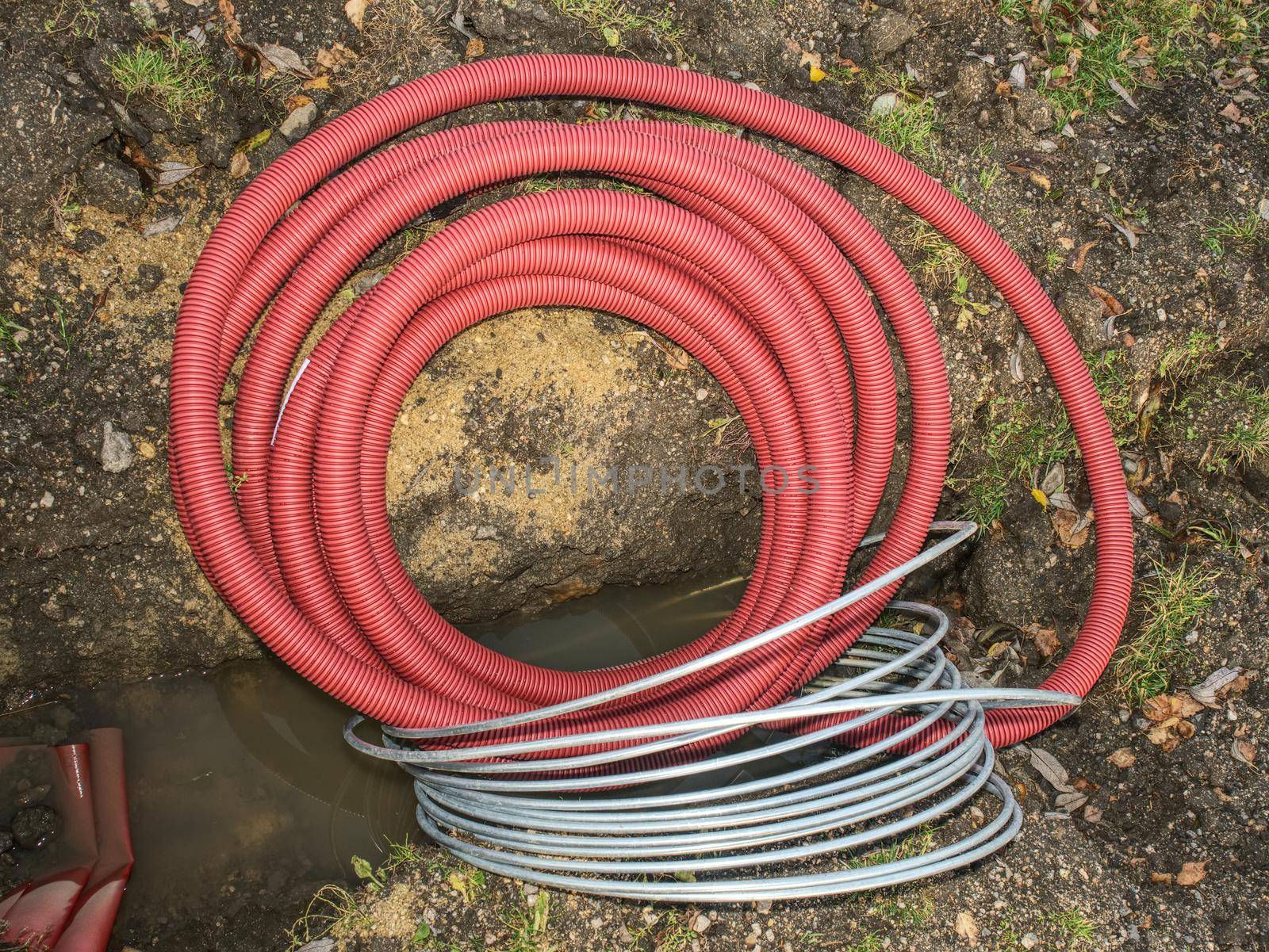 Electric cable in the flexible safety pipe in the pit