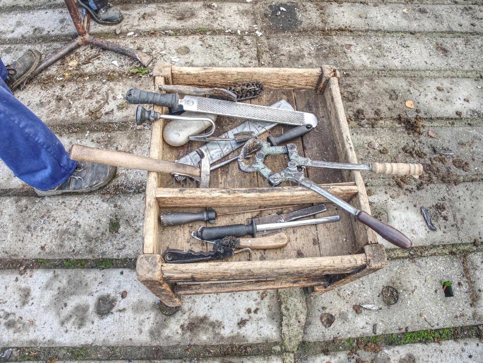 Blacksmith use especial tools for his work. Pliers, hoof knife, rasp, rough hoof file, whetstone, tongs, hammers and other metal working tools. Nesessary equipment for craftsman work. 