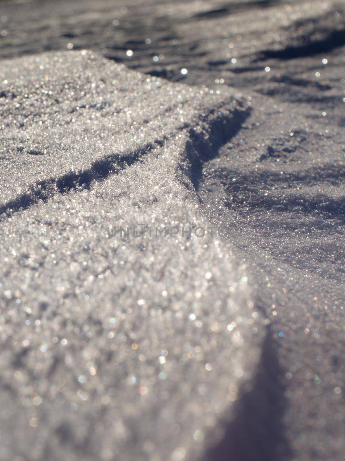 Snow ground with shadows and reflections.  by rdonar2