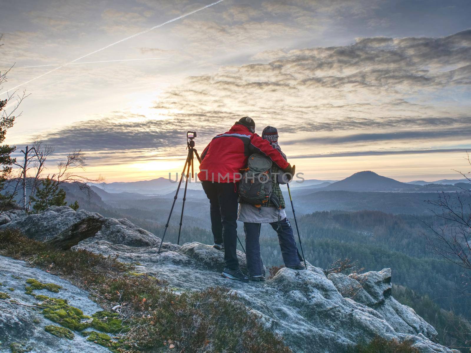 Two wildlife photographers at tripod with set  shinning camera by rdonar2