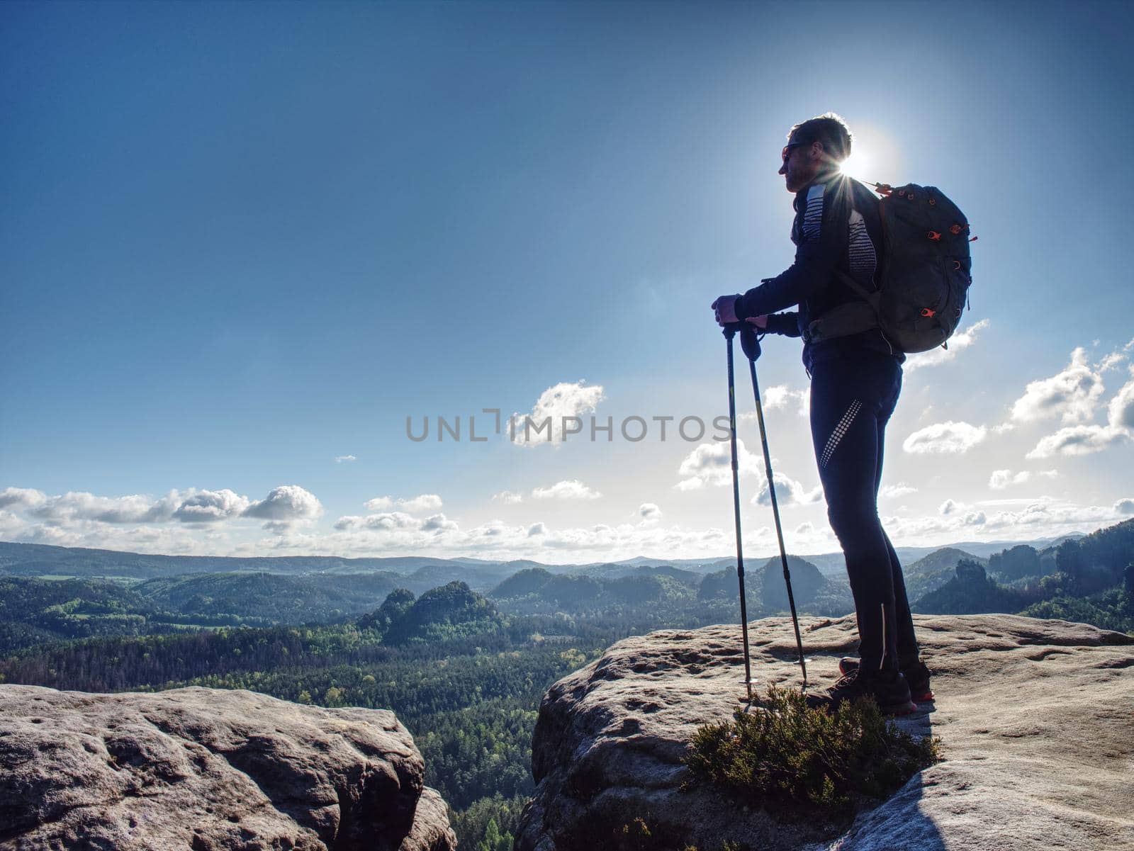  Hikers in mountains. Male strong carrier with backpack and camping on hike in nature. Travel Concept