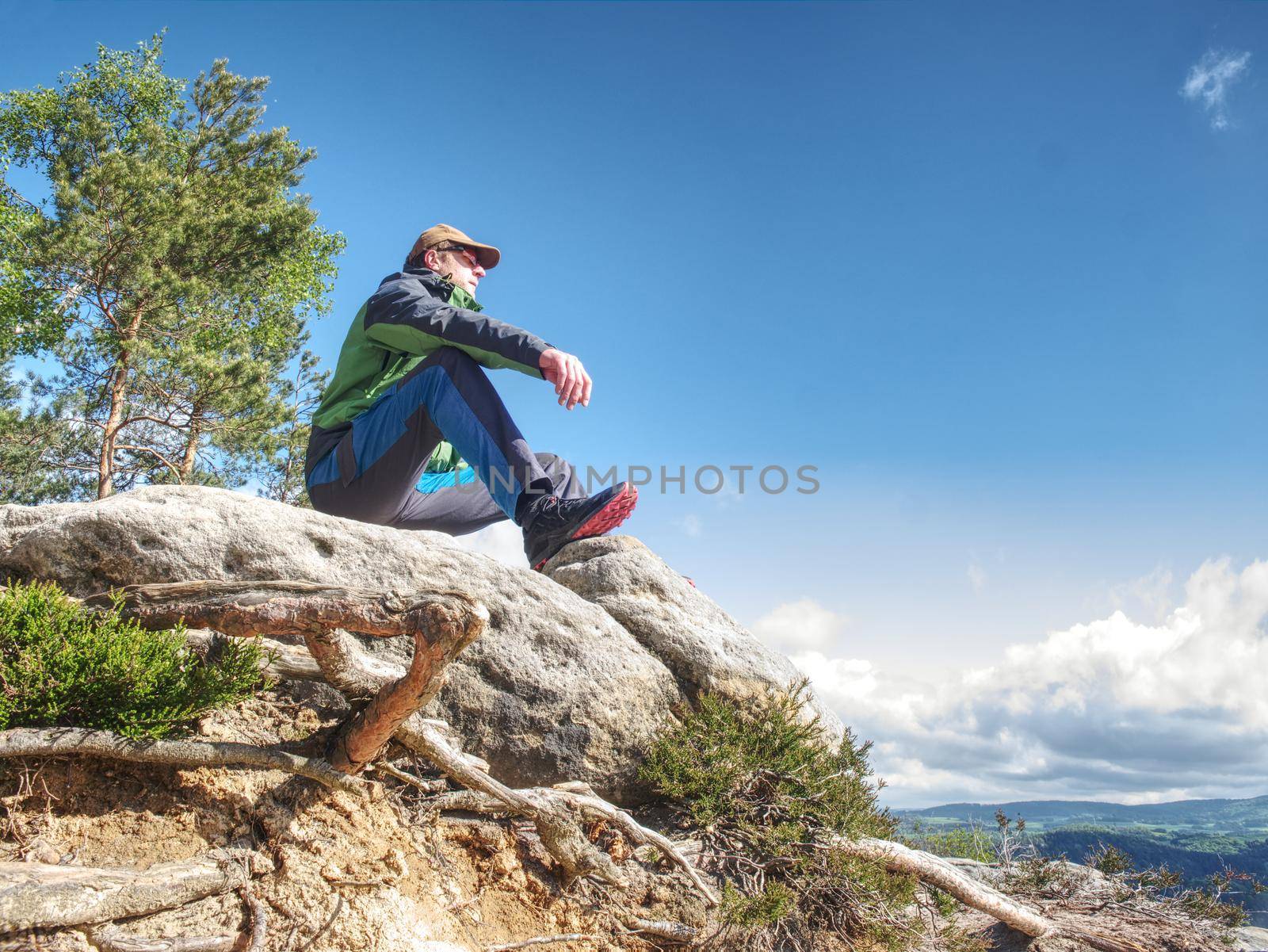 Man meditating in mountains. Travel Lifestyle relaxation emotional concept adventure summer vacations outdoor harmony