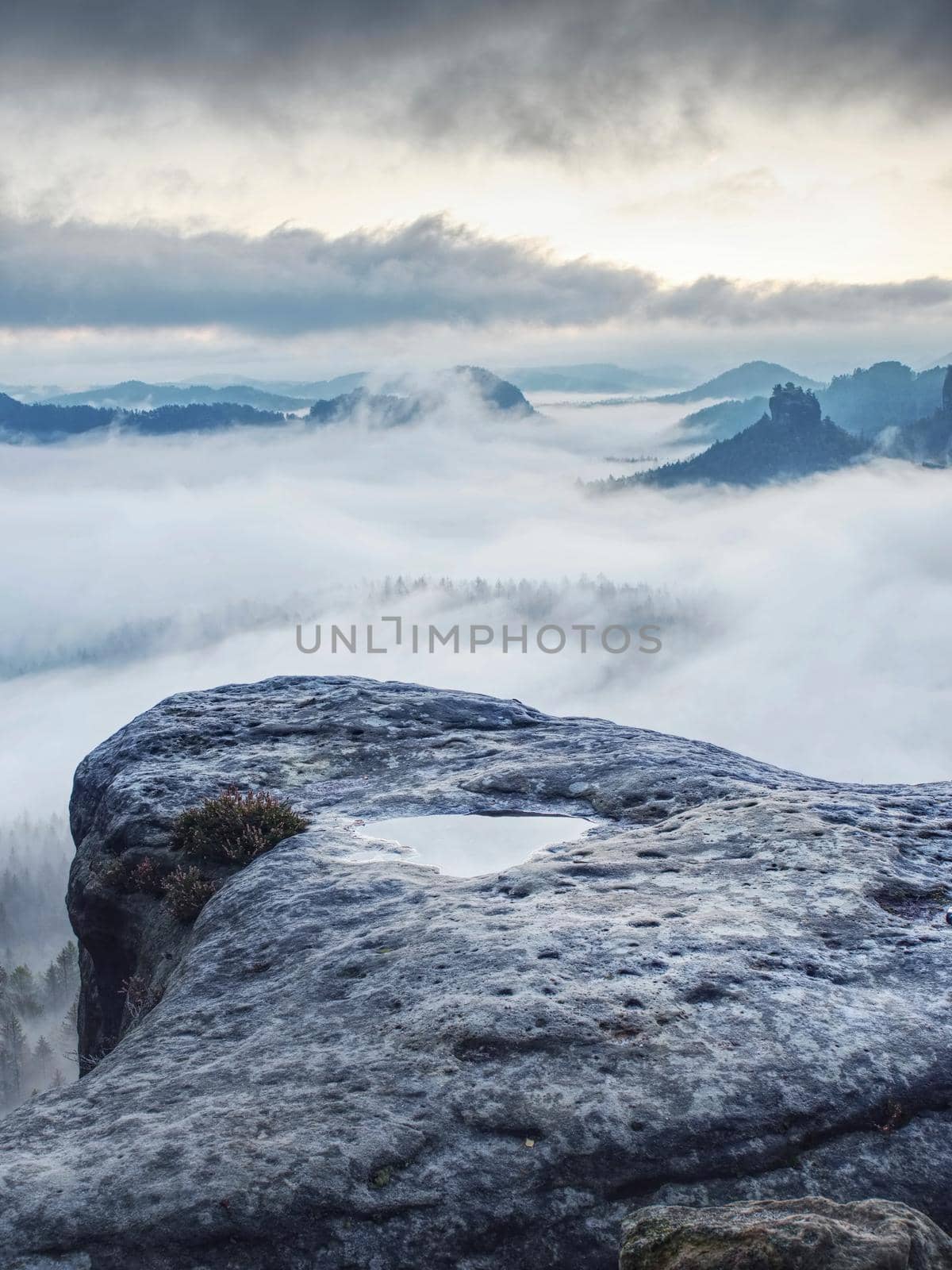 Misty mountains. Low clouds float between mountains. Dense fog lies in mountainous valley by rdonar2