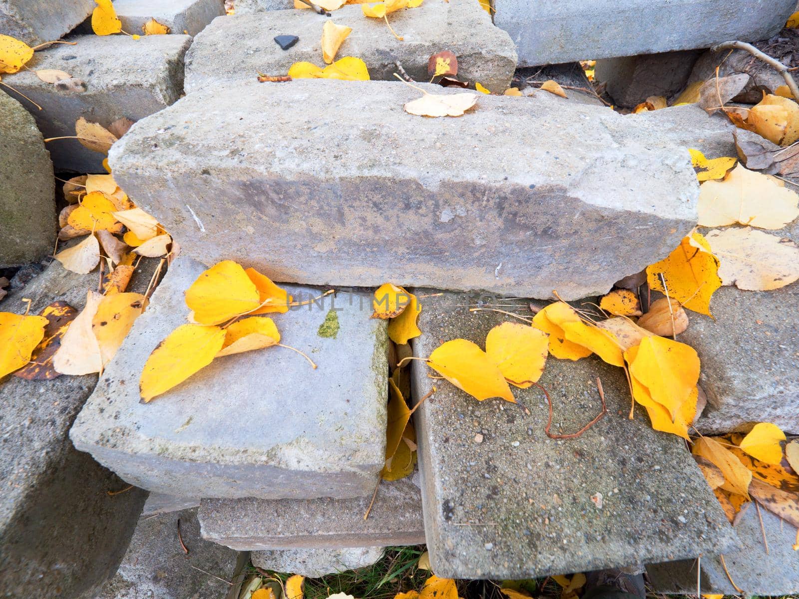 Stock of střacked stones and concrete blocks. Pile of building material ready for using