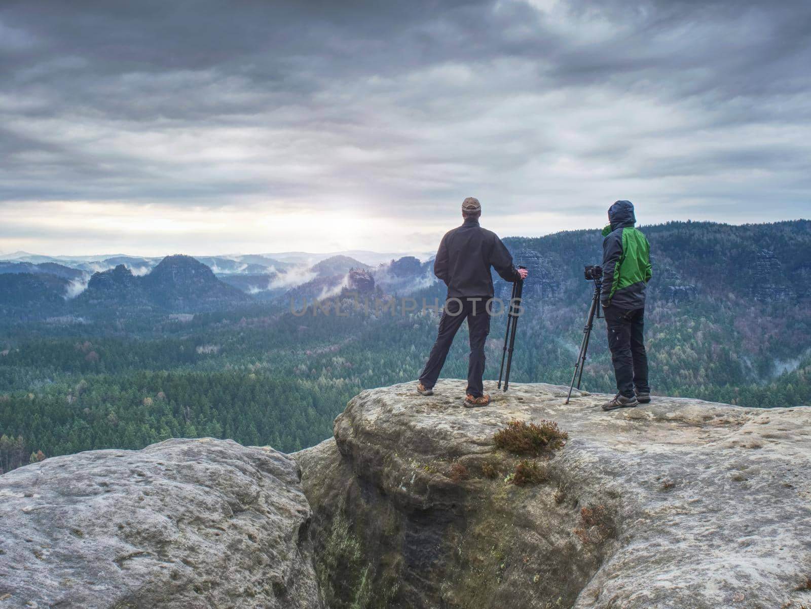 Tourist couple on the top of mountain.  by rdonar2