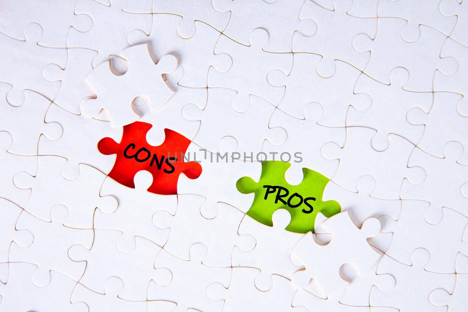 The words pros and cons on the missing puzzle pieces.  by tehcheesiong