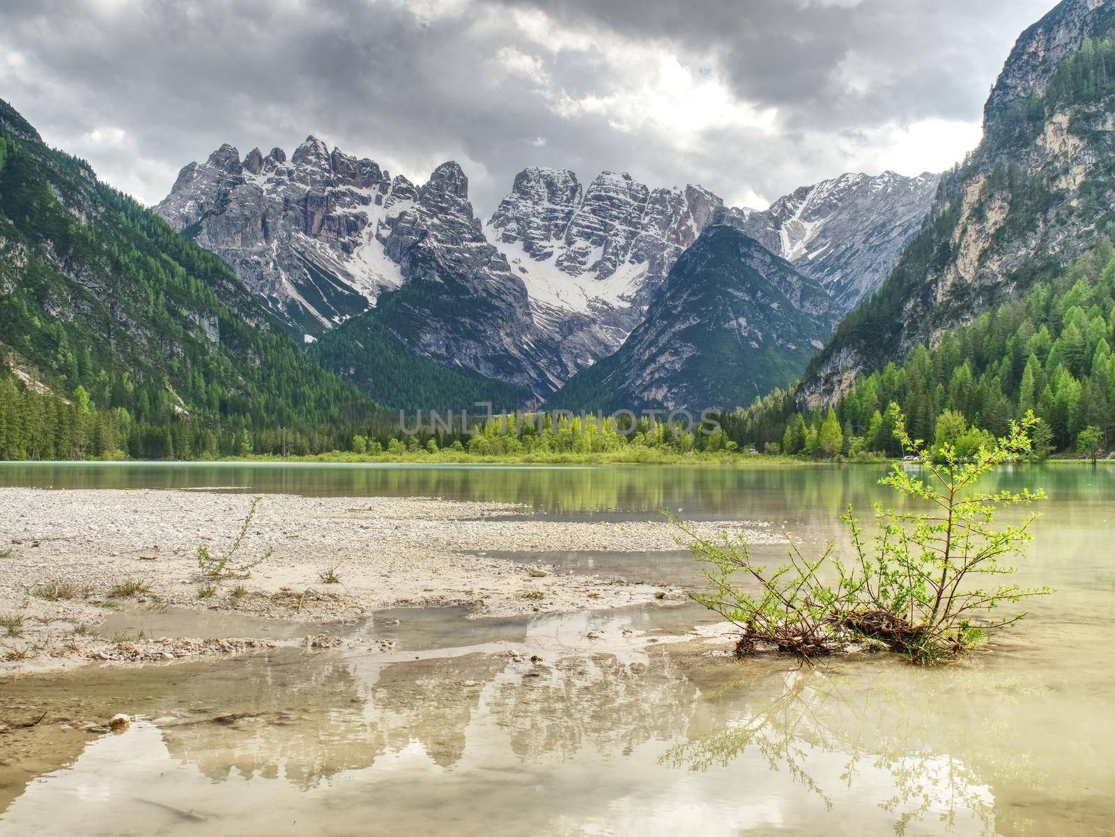 Lovely nature scenery with rocky peaks above beautiful lake.  by rdonar2