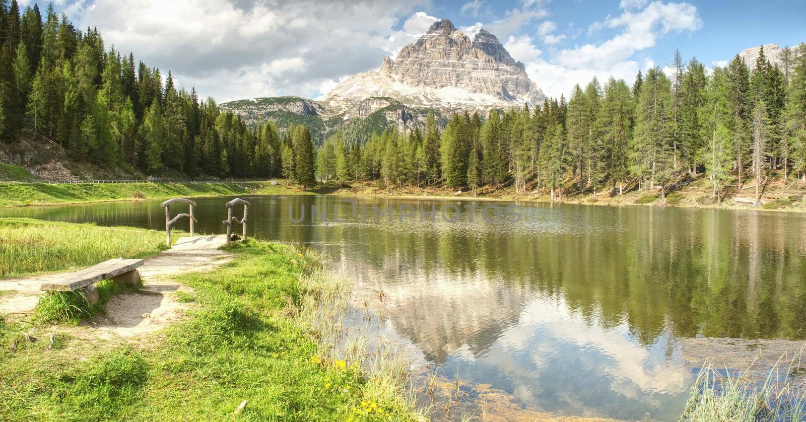 Tre Cime above Lago Di Antorno, wooden bridge, fresh green land by rdonar2