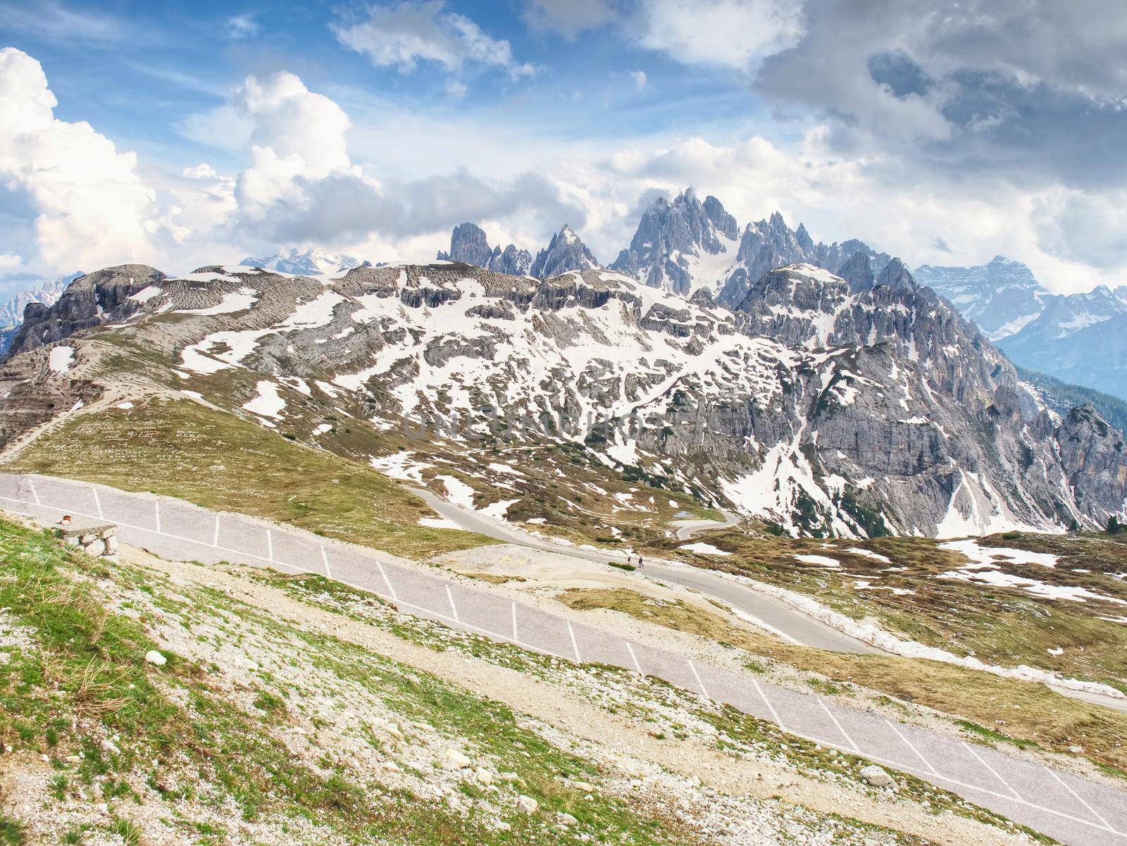 Asphalt road to parking place for motorhomes in National Nature Park Tre Cime In the Dolomites Alps, Italy.