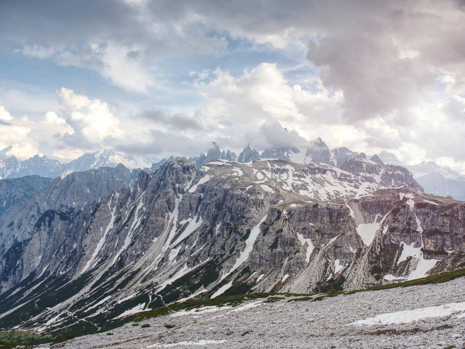 Wild mountains calm scene. Lifestyle active travel hiking. Scenic scenery of wild snowy mountains and alpine valleys.