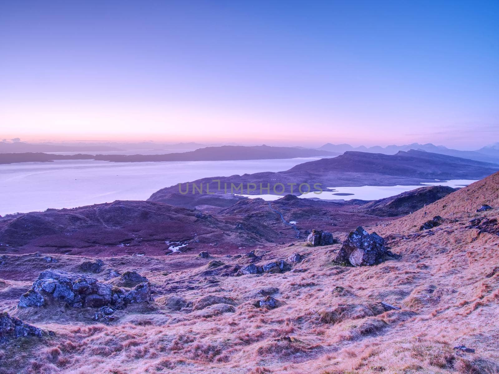 Highland Region Scotland United Kingdom , purople daybreak above sea at horizon