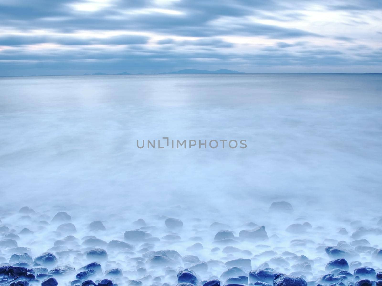 Rocky coast of sea. Slow shutter speed for smooth water level. Visite Talisker Bay on the Isle of Skye in Scotland at sunset