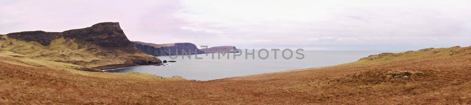Waterstein hill.  Gorgeous rolling hills and towering cliffs above bay close to Neist Point.  Isle of Skye. Panorama
