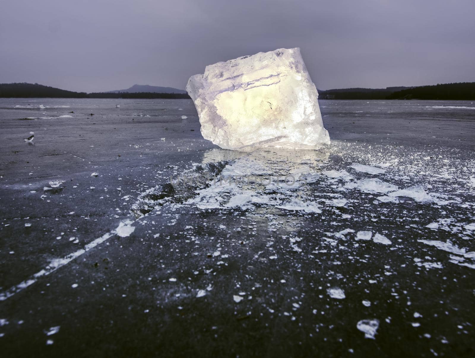 ice piece in blue shadows, on dark natural background. by rdonar2