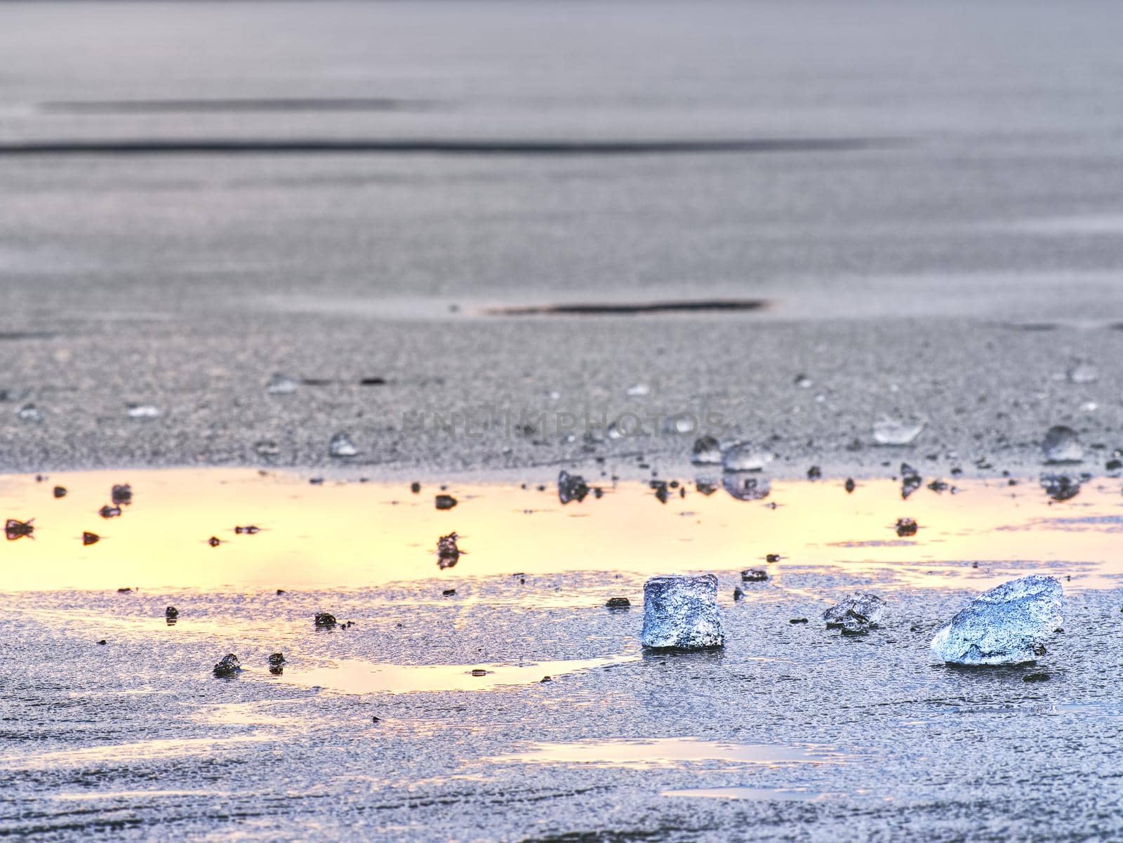 Broken floes and  iceberg. A large ice piece on freshwater ice that has broken off a glacier or an ice shelf. Reflection in ice