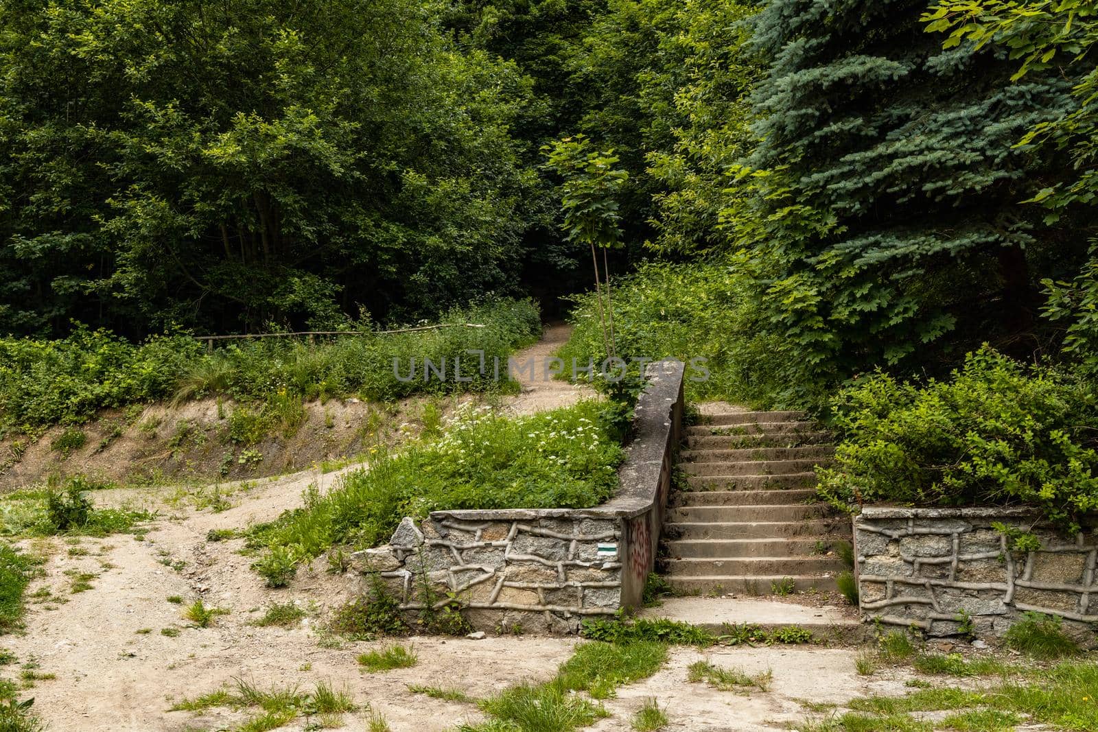 Small construction with concrete stairs at mountain trail in Walbrzych mountains by Wierzchu