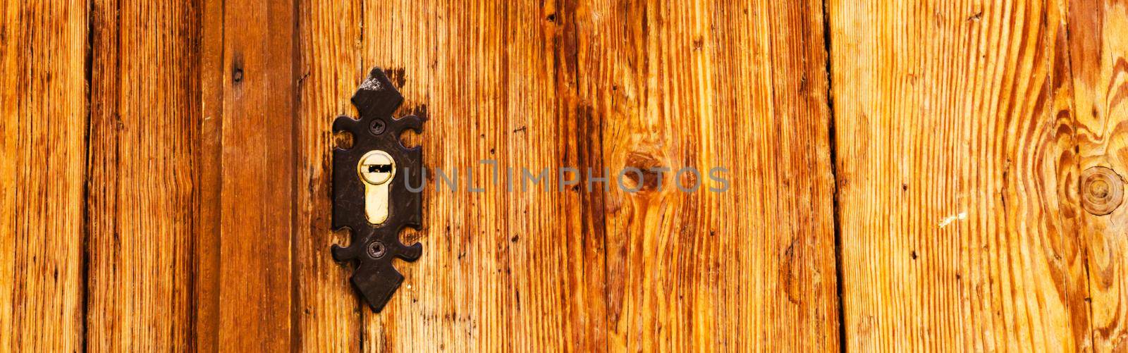 old door lock, aged wooden door, home security by Q77photo