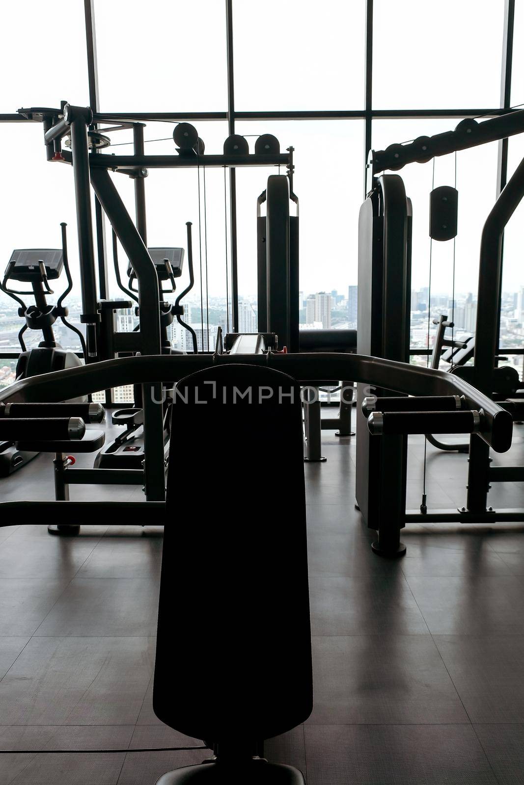 exercise machines in an empty gym by ponsulak
