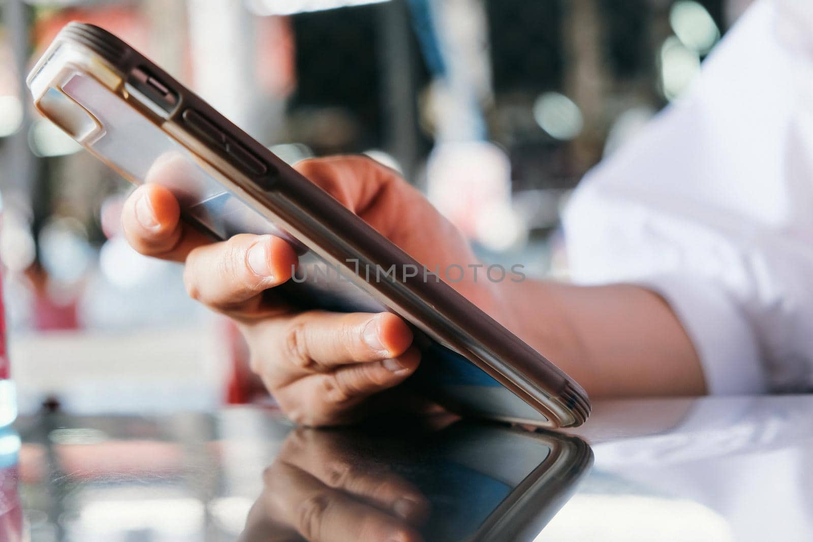 close up image of Teenage girl text messaging on her phone