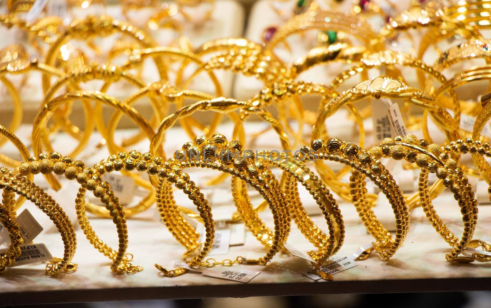 Display of dozens of golden bracelets in Turkish style by berkay