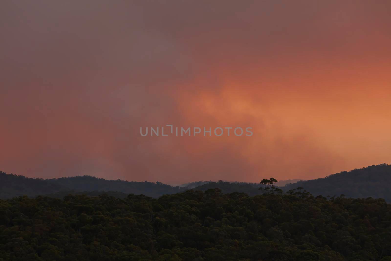 Photograph of bushfire smoke at sunset from hazard reduction burning in the Blue Mountains in New South Wales in Australia