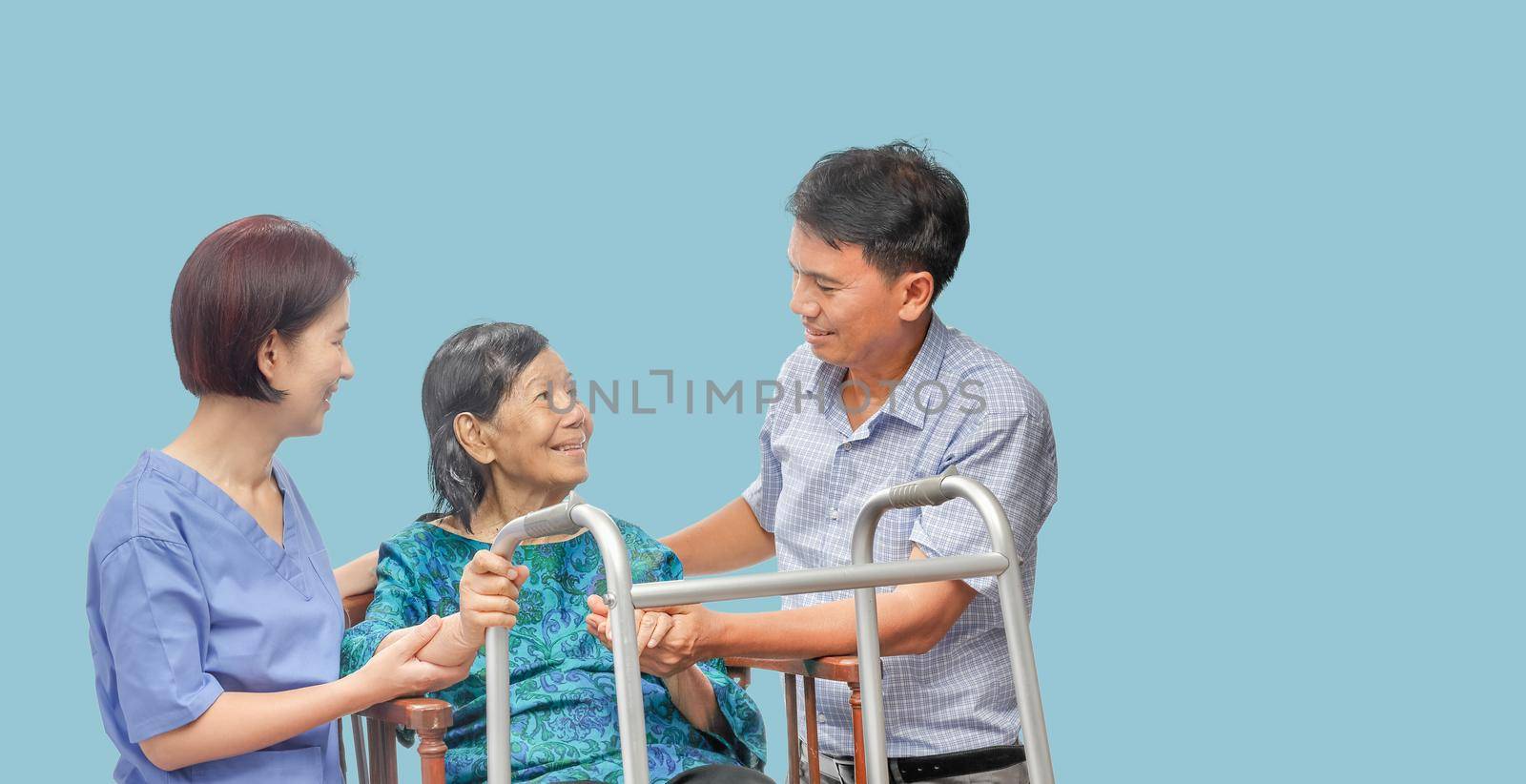 Son looking after elderly mother on wheelchair with caregiver by toa55