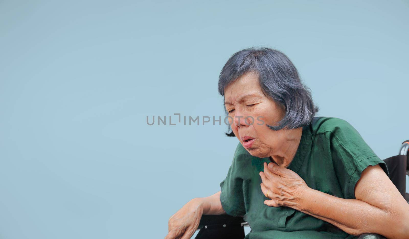 elderly woman cough ,choke on wheelchair