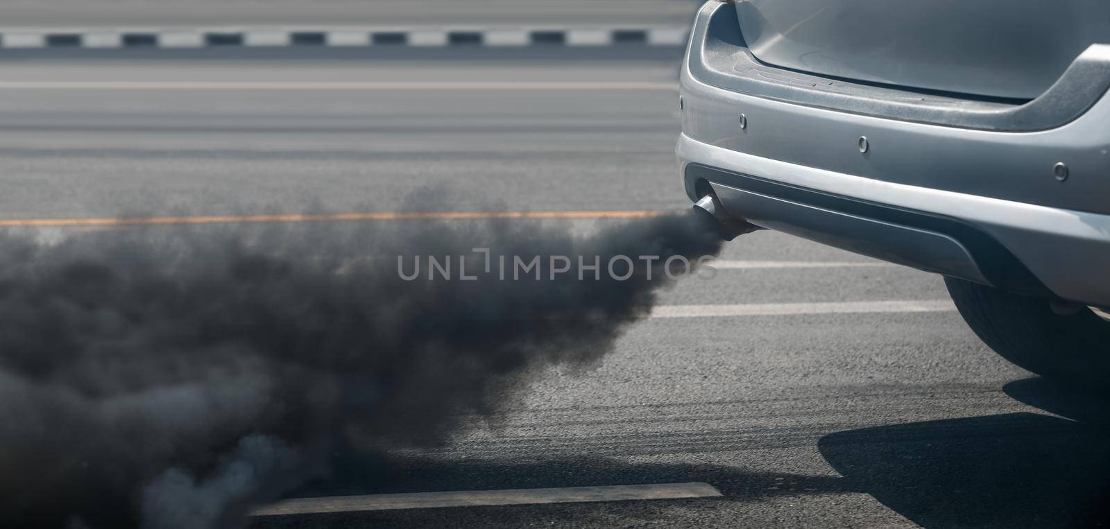 air pollution crisis in city from diesel vehicle exhaust pipe on road by toa55