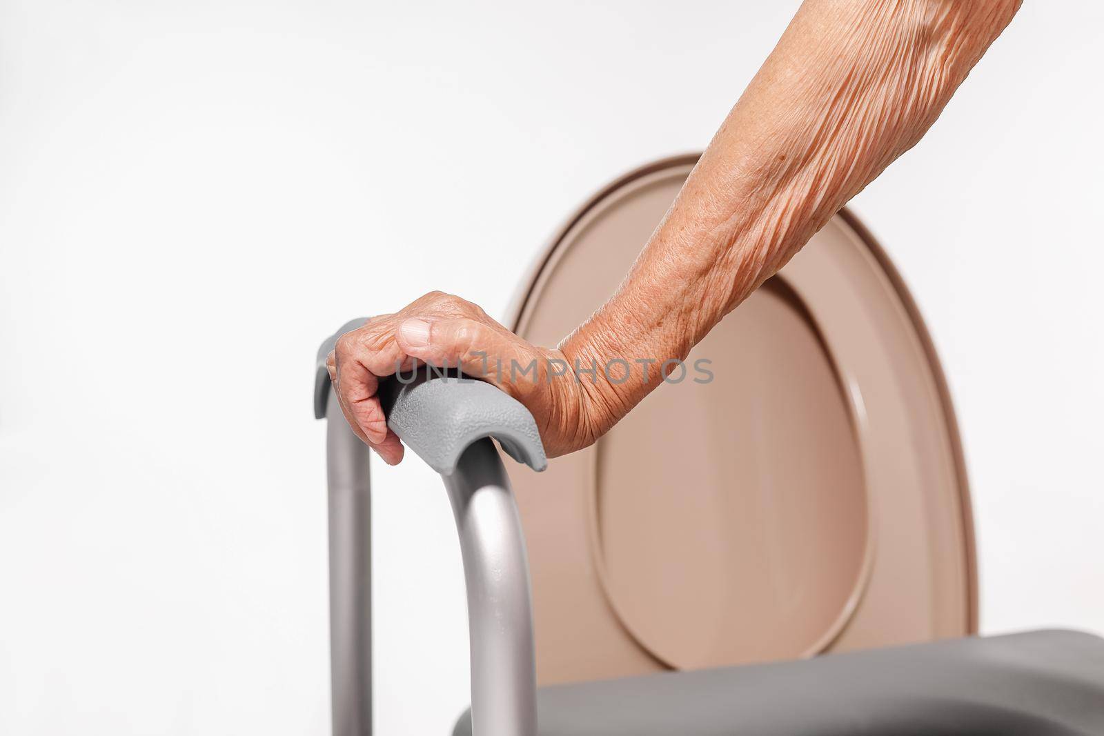 Elderly woman using mobile toilet seat chair by toa55
