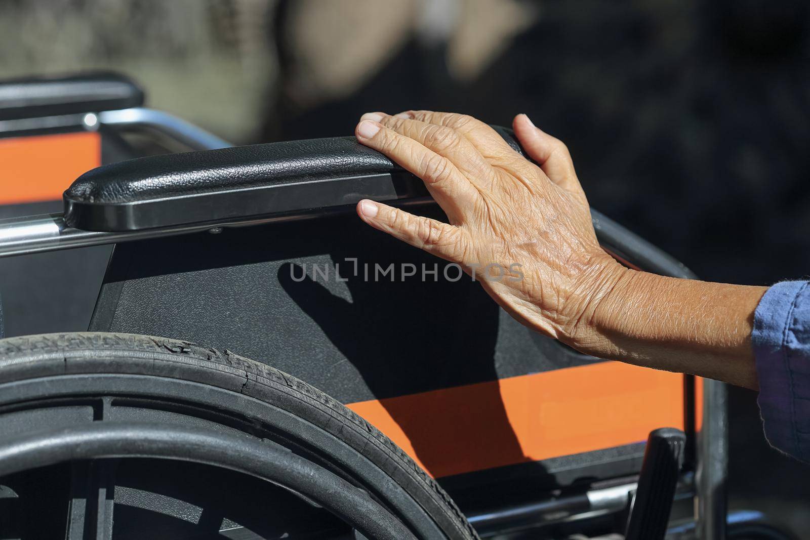 Elderly hands on a wheelchair. by toa55
