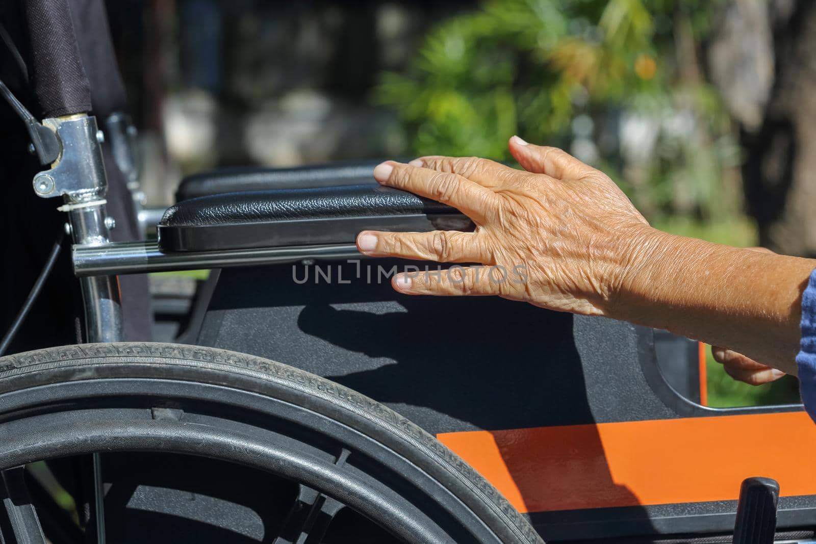 Elderly hands on a wheelchair. by toa55